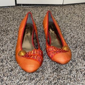 Kitten heeled closed toed shoes. Very unique and bright